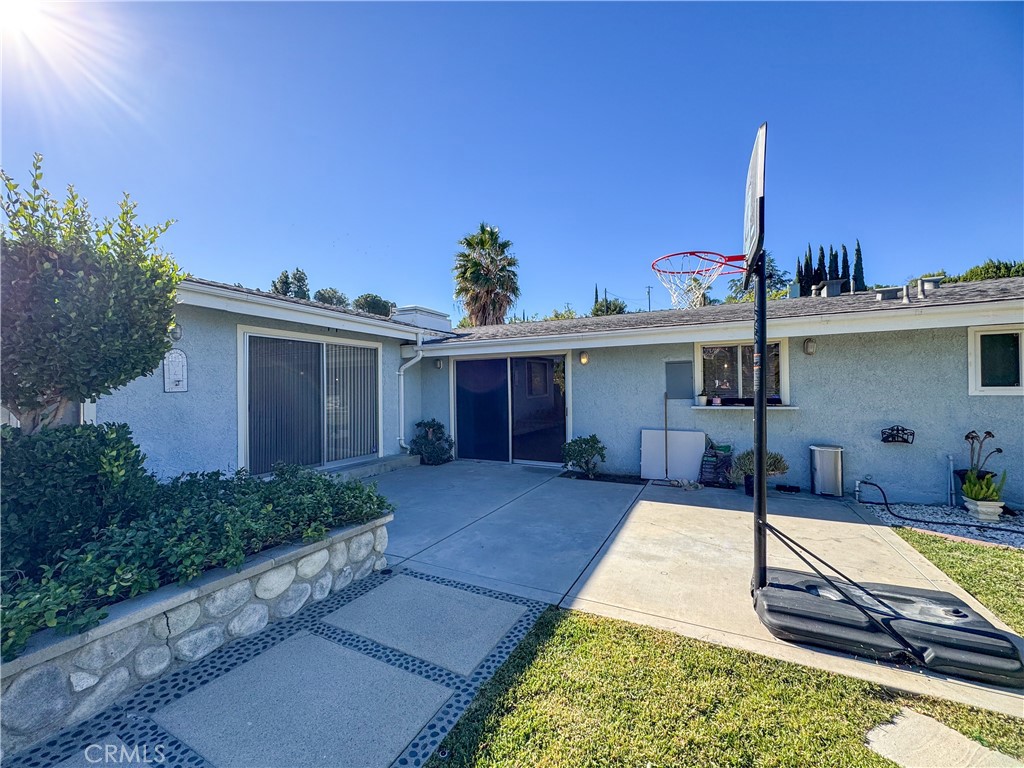 12162 Bradford Place Granada Hills, CA 91344 - Photo 19 of 27 front view of a house with a patio
