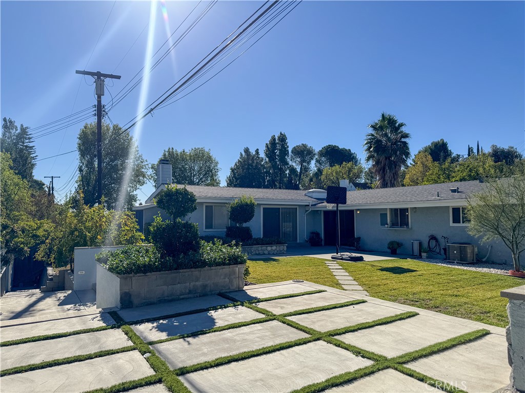 12162 Bradford Place Granada Hills, CA 91344 - Photo 23 of 27 a view of a house with swimming pool and sitting area