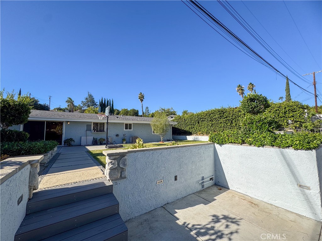 12162 Bradford Place Granada Hills, CA 91344 - Photo 24 of 27 a view of a terrace with outdoor seating