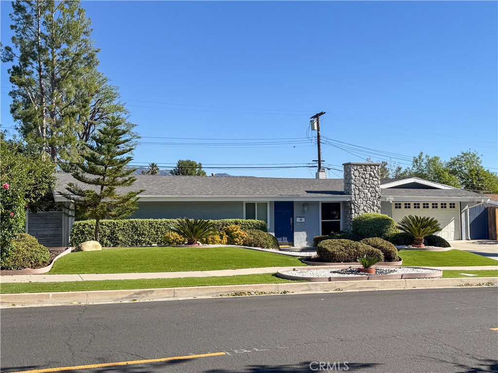 12162 Bradford Place Granada Hills, CA 91344 - Photo 26 of 27 a front view of a house with a yard