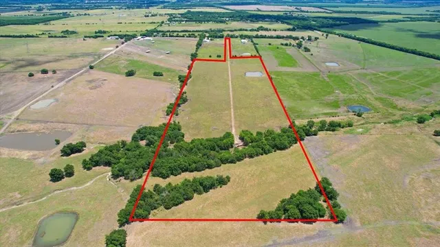 swimming pool view with a garden space