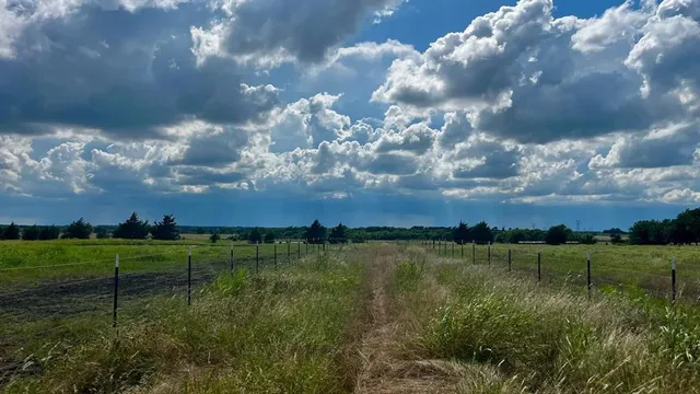 a view of a lake with houses in the back
