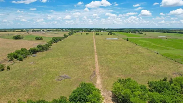 a view of a lake with a yard