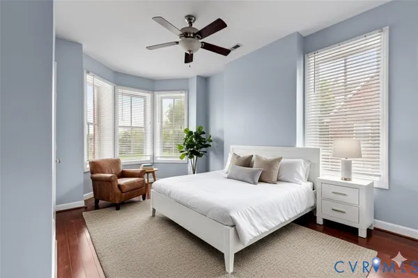 a bedroom with a bed and a couch
