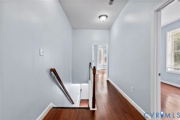 a view of a hallway with windows