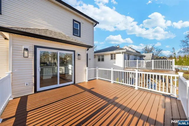a view of a house with wooden deck