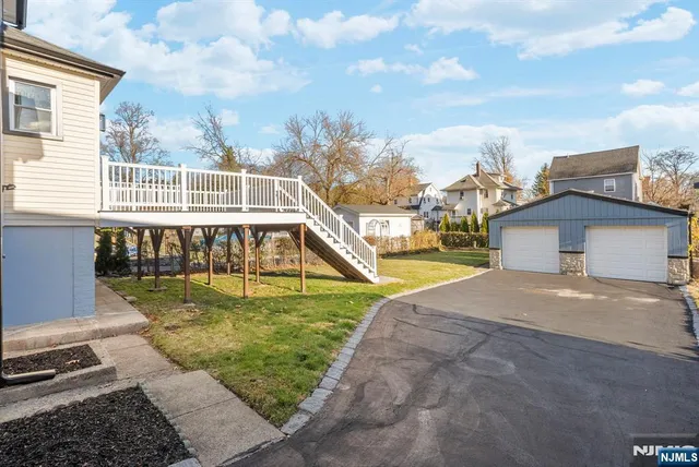 a view of a house with swimming pool and sitting area