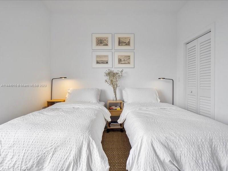 1053 Northwest 29th Street Miami, FL 33127 - Photo 20 of 38 a bedroom with a bed and wall painting