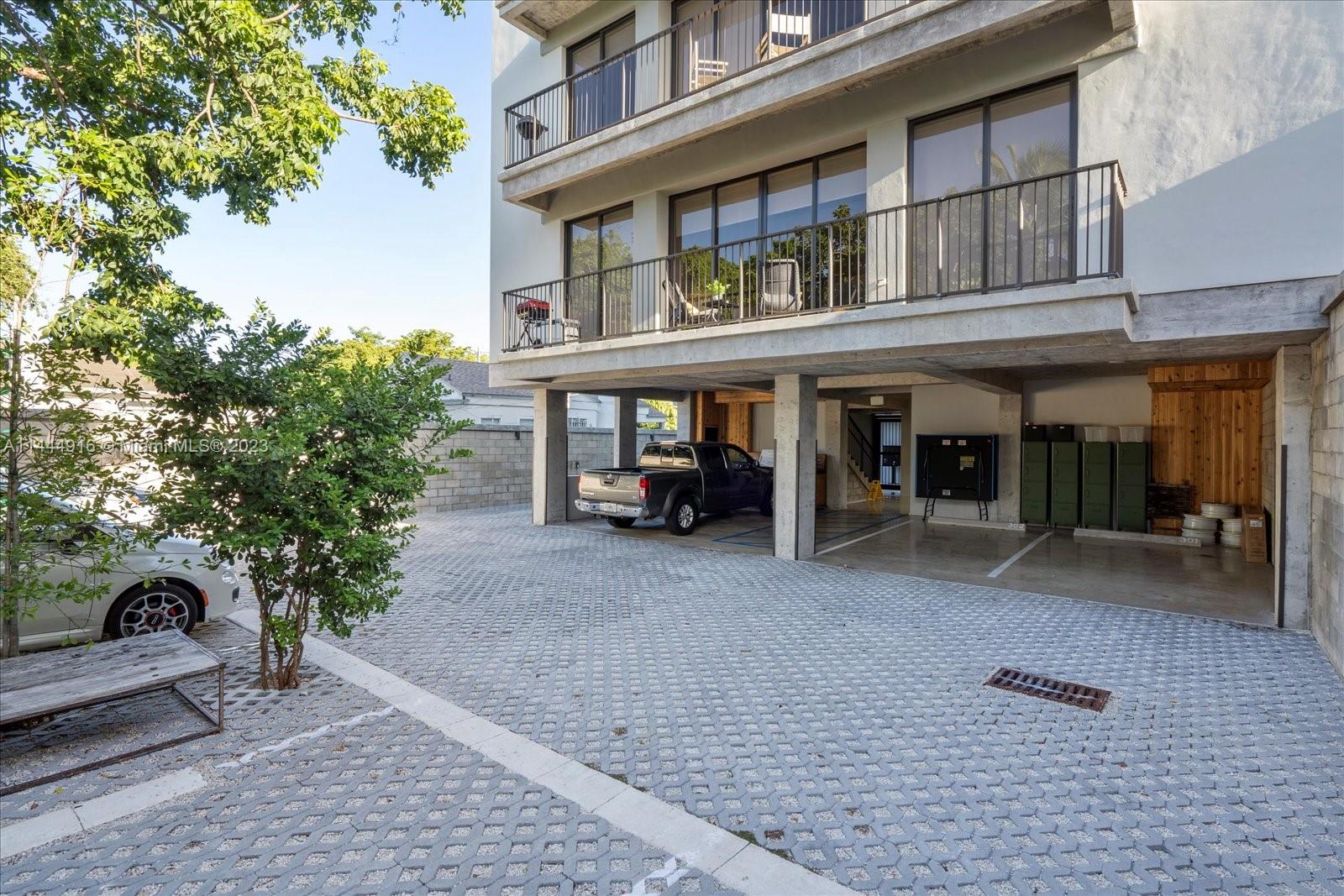 1053 Northwest 29th Street Miami, FL 33127 - Photo 3 of 38 a view of a building with sitting area