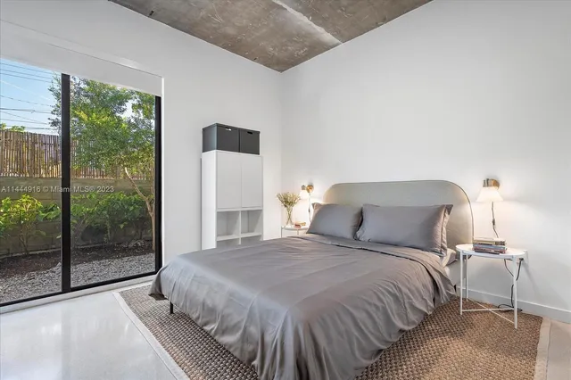 a view of a back yard from a corridor