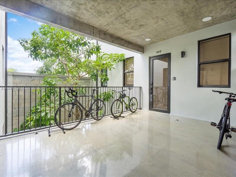 1053 Northwest 29th Street Miami, FL 33127 - Photo 4 of 38 a view of a porch with a tv