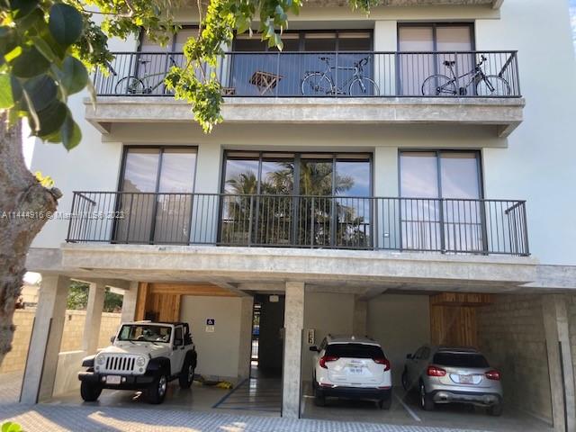 1053 Northwest 29th Street Miami, FL 33127 - Photo 8 of 38 a car parked in front of a building