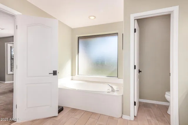 a bathroom with a bathtub and a sink