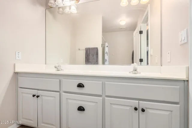 an empty room with closet and fan