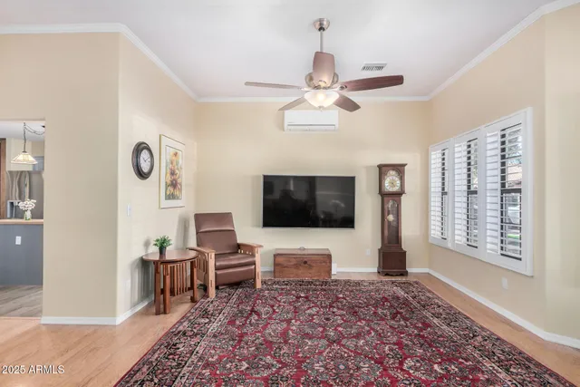 a living room with furniture and a rug