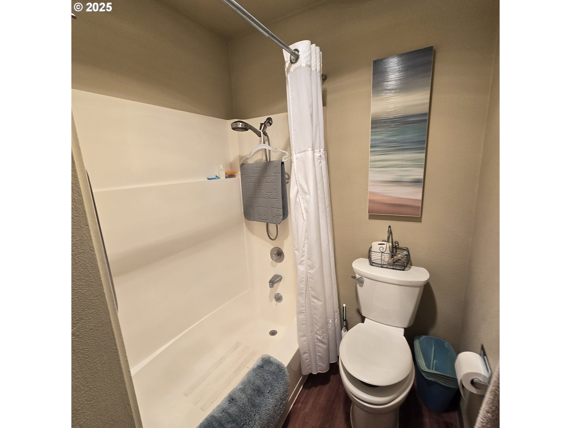 1000 Southeast Bay Blvd. Boulevard, Unit 124 Newport, OR 97365 - Photo 13 of 22 a white toilet sitting next to a bathroom sink