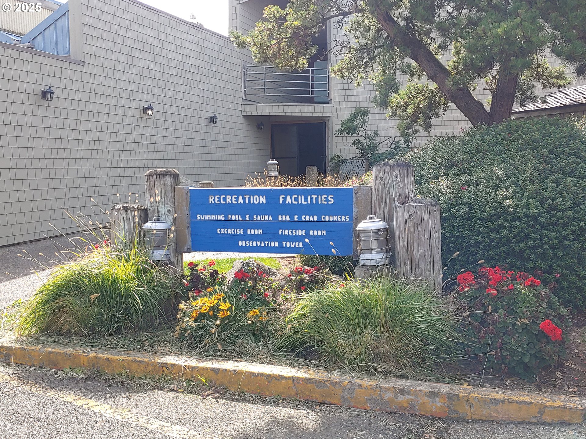 1000 Southeast Bay Blvd. Boulevard, Unit 124 Newport, OR 97365 - Photo 16 of 22 a view of a house with a yard and potted plants
