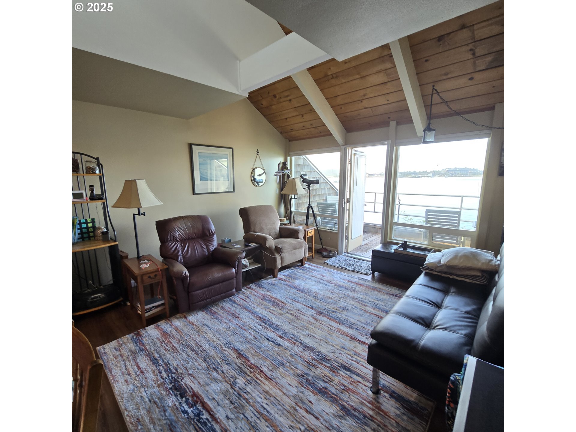 1000 Southeast Bay Blvd. Boulevard, Unit 124 Newport, OR 97365 - Photo 6 of 22 a living room with furniture and a large window