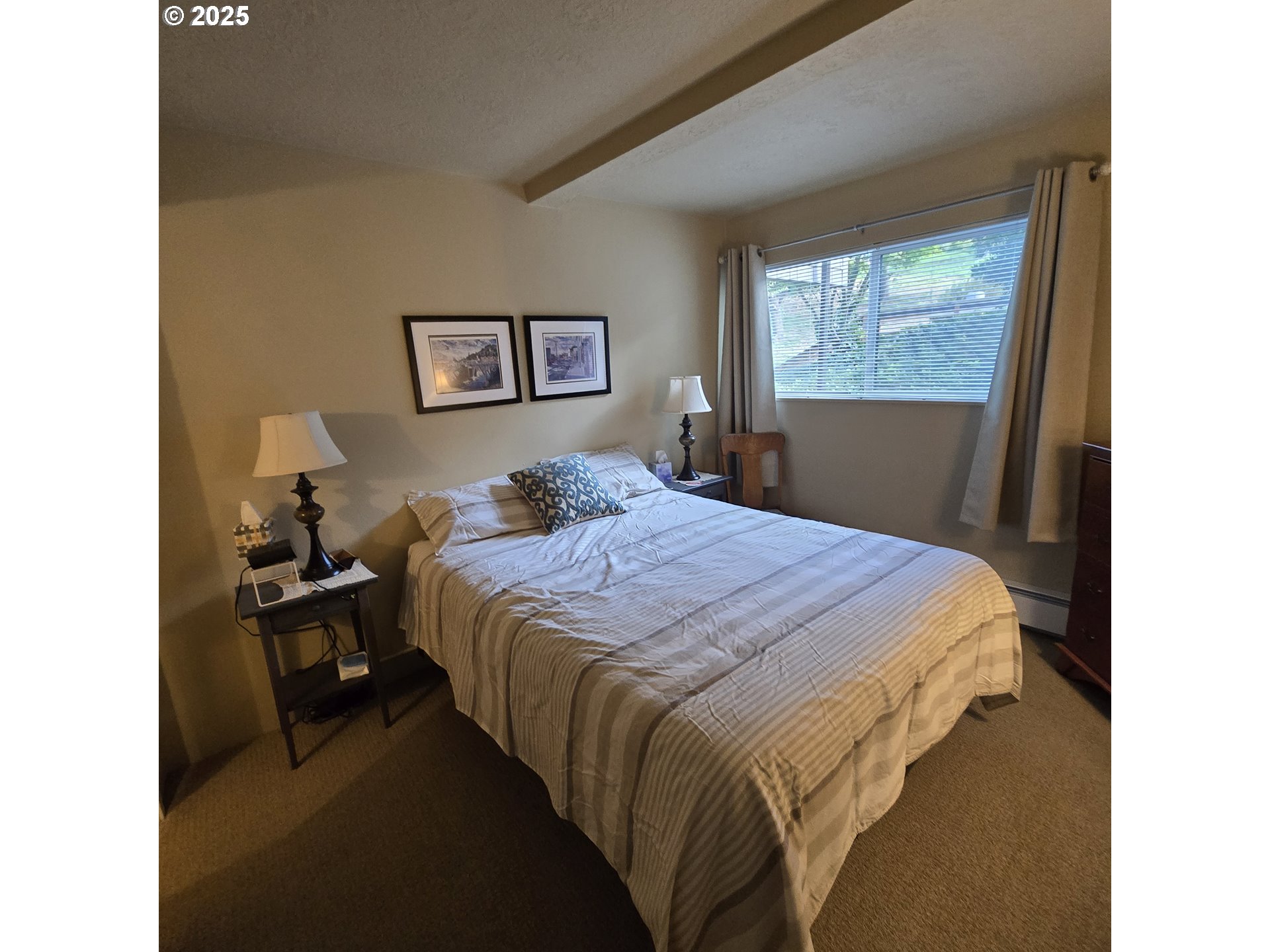 1000 Southeast Bay Blvd. Boulevard, Unit 124 Newport, OR 97365 - Photo 9 of 22 a bedroom with a bed and window