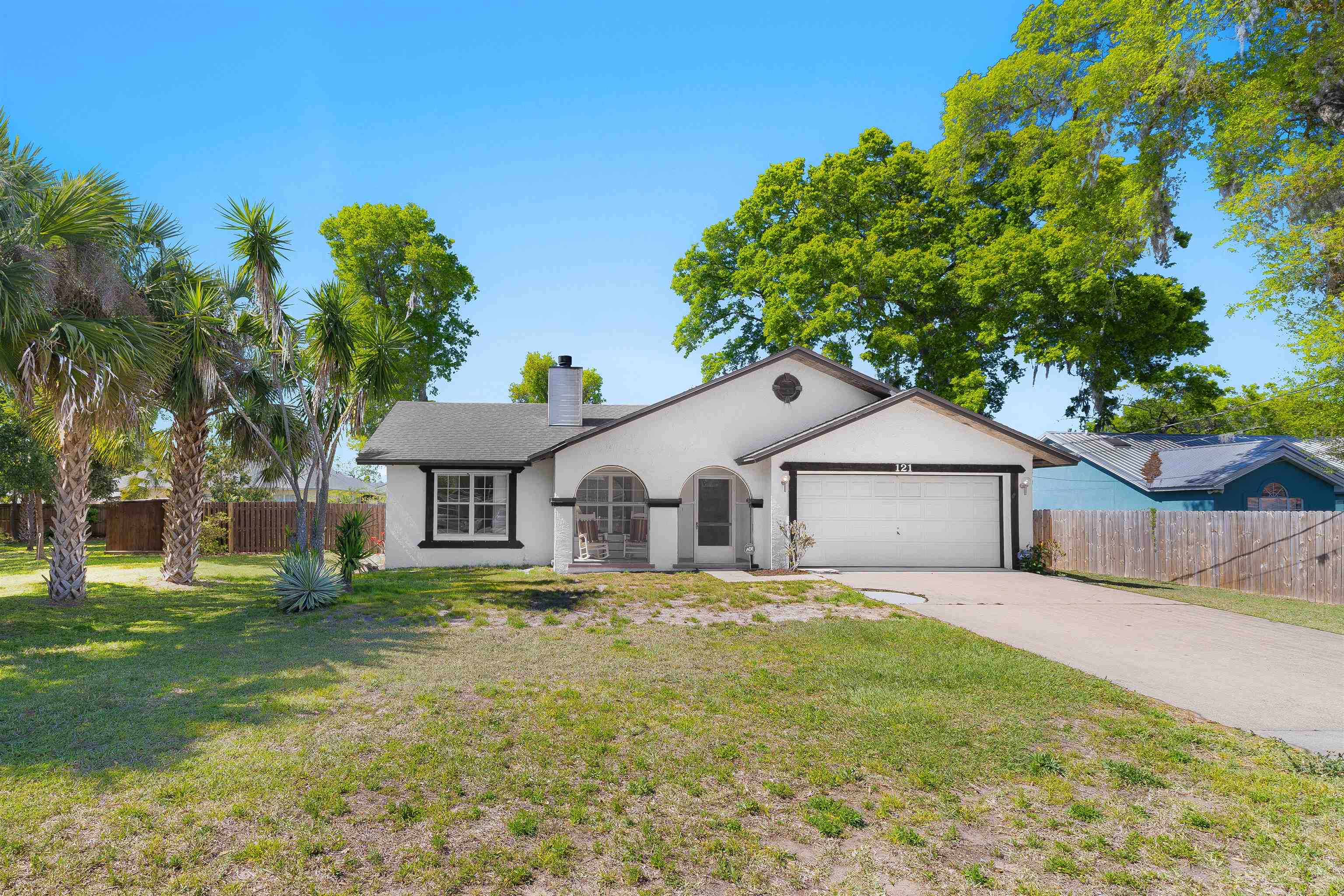 121 Faun Road St. Augustine, FL 32086 - Photo 1 of 23 a white house that has a tree in front of it