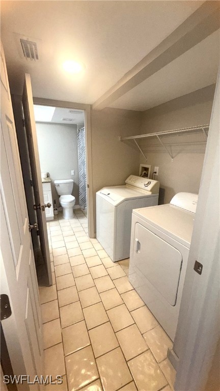 606 Gerald Avenue, Unit 115 Lehigh Acres, FL 33936 - Photo 6 of 7 a utility room with dryer and washer