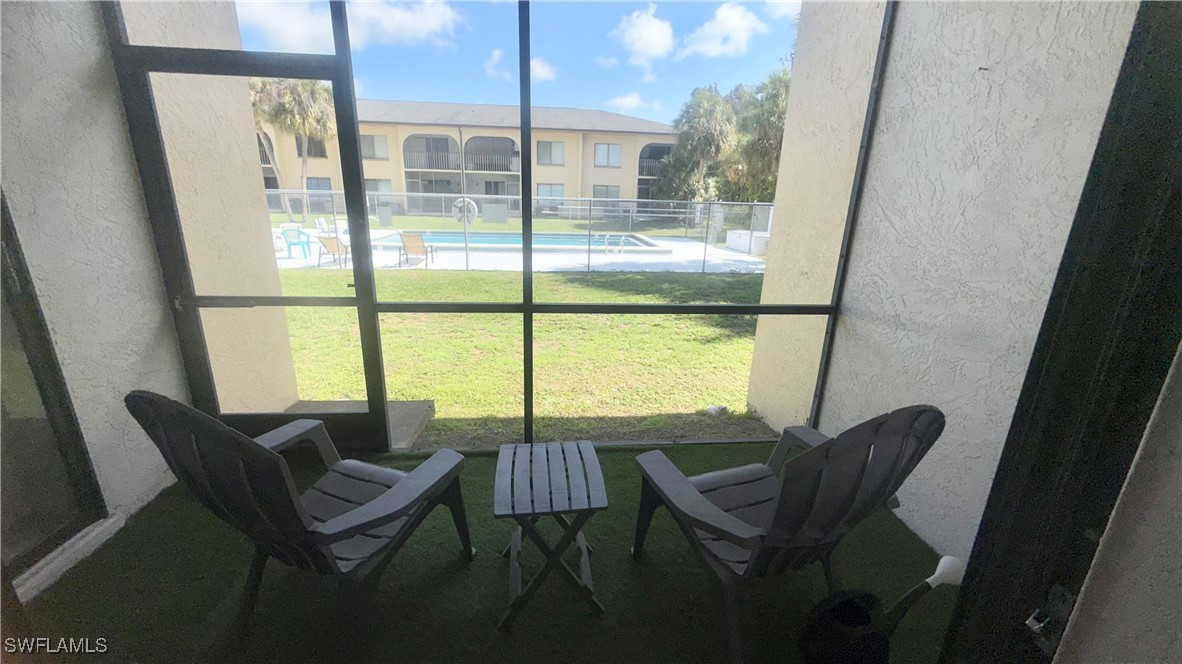 606 Gerald Avenue, Unit 115 Lehigh Acres, FL 33936 - Photo 7 of 7 a view of a room with a furniture