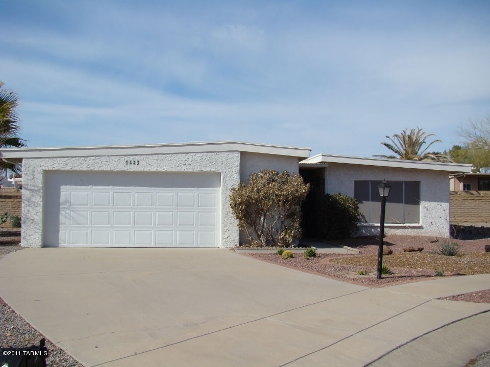 1443 North Rio-Aros Green Valley, AZ 85614 - Photo 2 of 19 front view of a house with potted plants