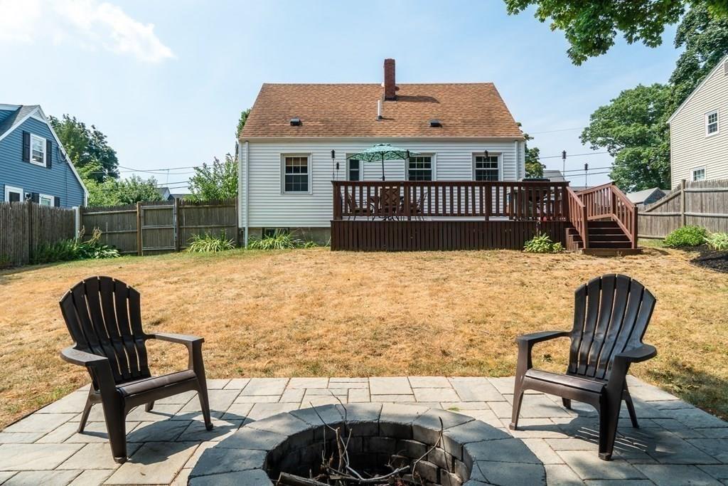 70 Brae Road Weymouth, MA 02191 - Photo 15 of 16 a view of a patio with table and chairs with wooden floor and fence