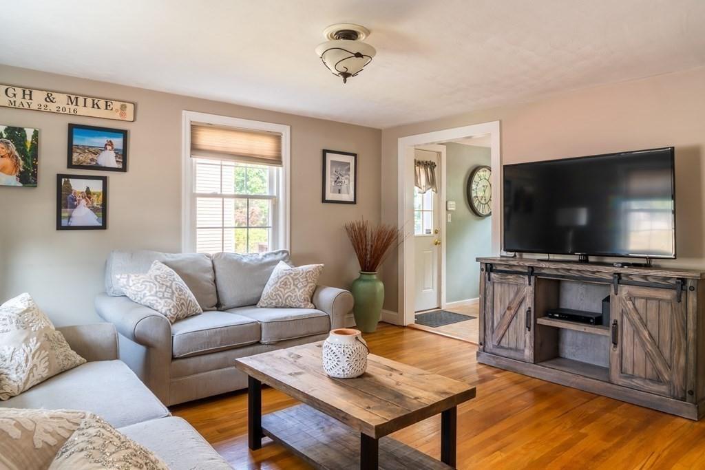 70 Brae Road Weymouth, MA 02191 - Photo 3 of 16 a living room with furniture and a flat screen tv