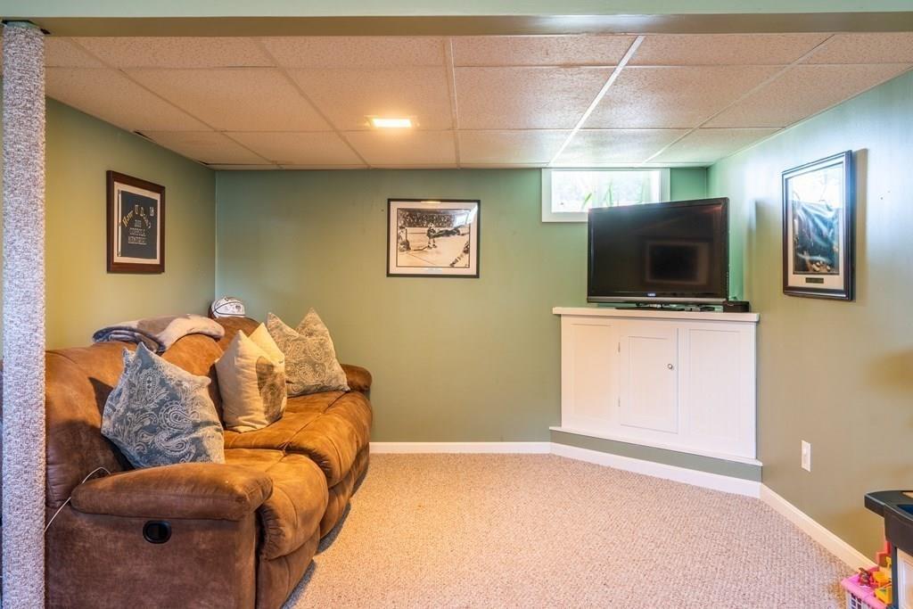 70 Brae Road Weymouth, MA 02191 - Photo 10 of 16 a bedroom with furniture and a flat screen tv