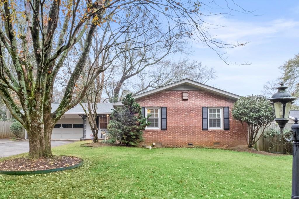 4172 North Shallowford Road Chamblee, GA 30341 - Photo 1 of 1 a front view of a house with garden