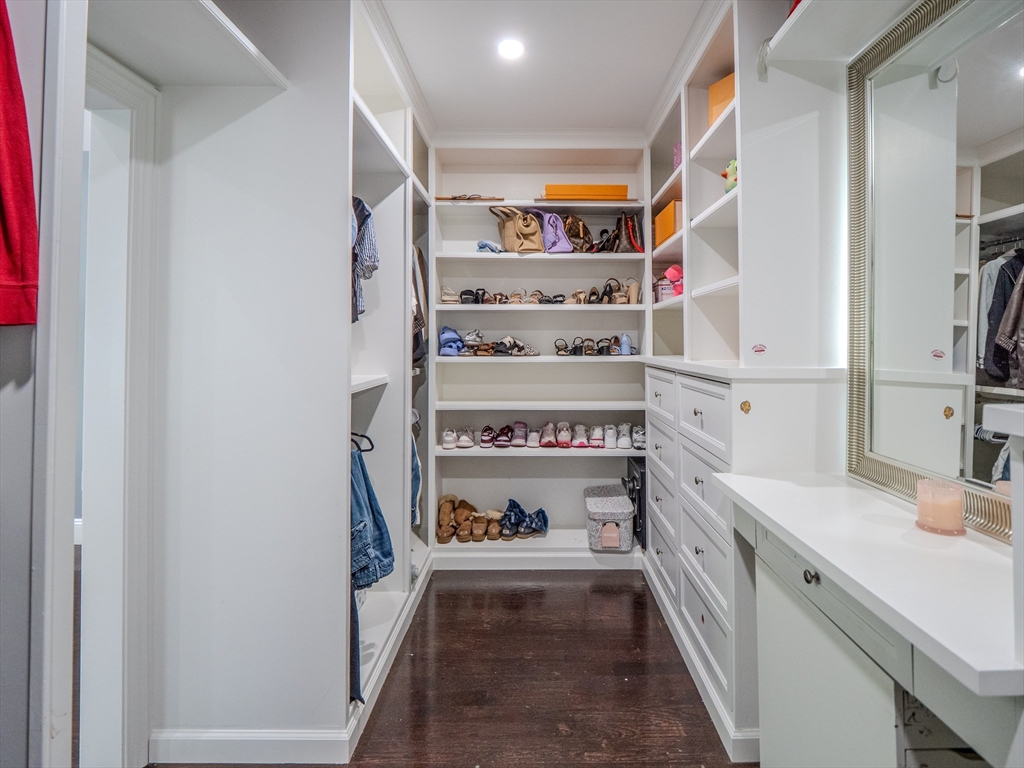 159 Mishawum Road Woburn, MA 01801 - Photo 22 of 41 a view of walk in closet with clothes and shoes
