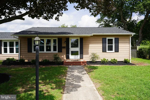 front view of a house with a yard