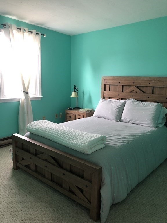 36 Atkins Road, Unit B5 Sandwich, MA 02537 - Photo 13 of 23 a bedroom with a bed and a window