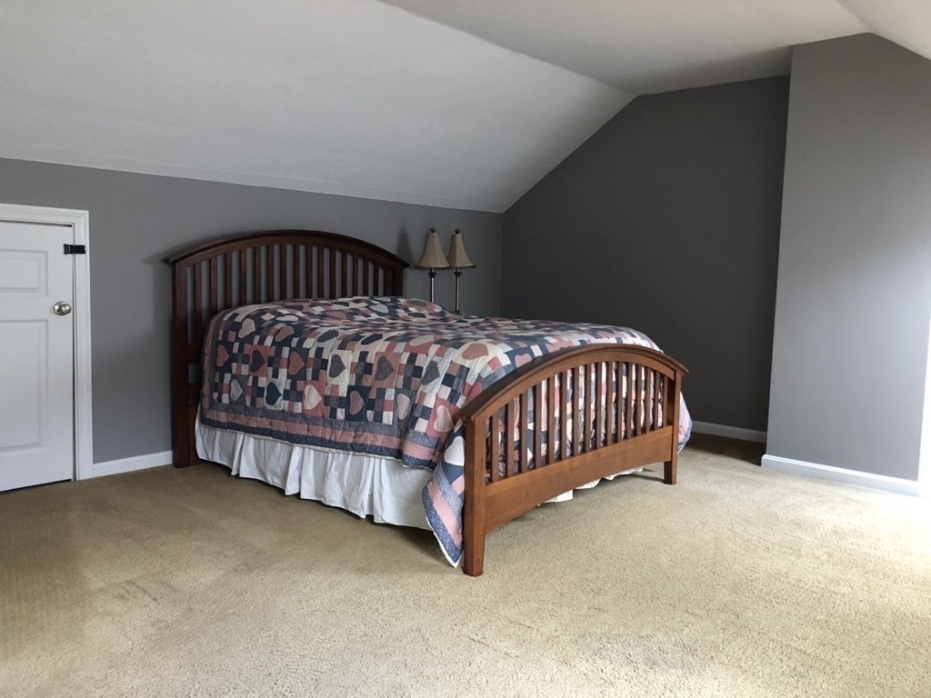 36 Atkins Road, Unit B5 Sandwich, MA 02537 - Photo 14 of 23 a bed sitting in a room with a baby crib