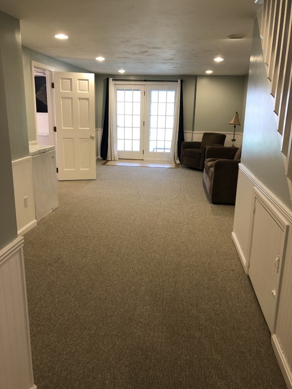 36 Atkins Road, Unit B5 Sandwich, MA 02537 - Photo 16 of 23 a view of a big room with windows and chandelier