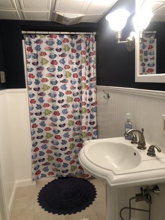 36 Atkins Road, Unit B5 Sandwich, MA 02537 - Photo 18 of 23 a bathroom with a sink and a mirror