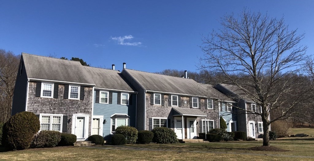36 Atkins Road, Unit B5 Sandwich, MA 02537 - Photo 2 of 23 a front view of residential houses with yard