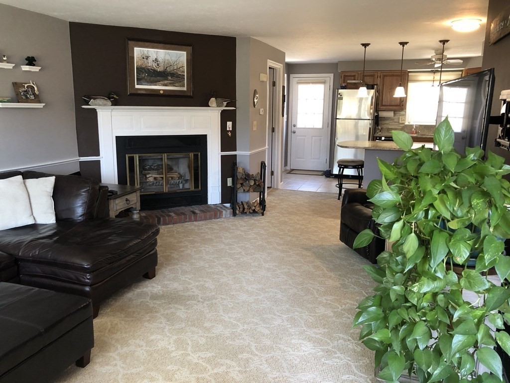 36 Atkins Road, Unit B5 Sandwich, MA 02537 - Photo 4 of 23 a living room with furniture and a fireplace