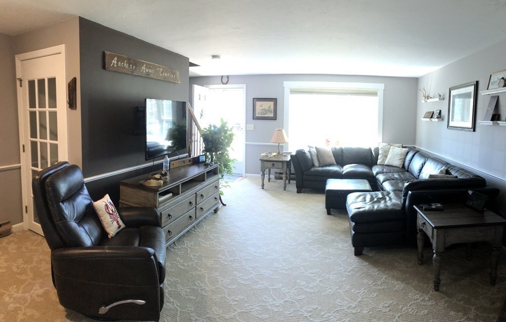36 Atkins Road, Unit B5 Sandwich, MA 02537 - Photo 5 of 23 a living room with furniture and a flat screen tv