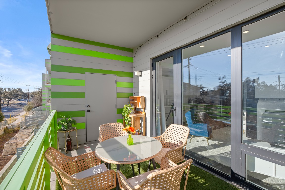 4004 Banister Lane, Unit 202 Austin, TX 78704 - Photo 20 of 23 a backyard of a house with dining table and chairs