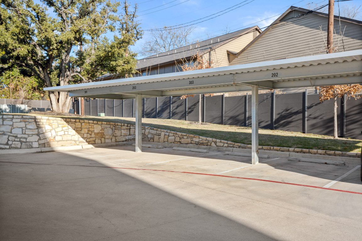 4004 Banister Lane, Unit 202 Austin, TX 78704 - Photo 21 of 23 front view of a house with a large window and plants