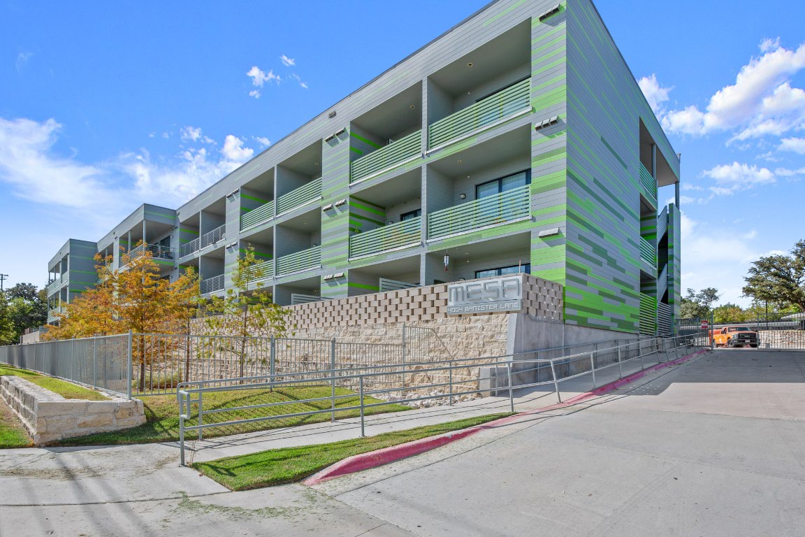 4004 Banister Lane, Unit 202 Austin, TX 78704 - Photo 22 of 23 a view of building with parking area