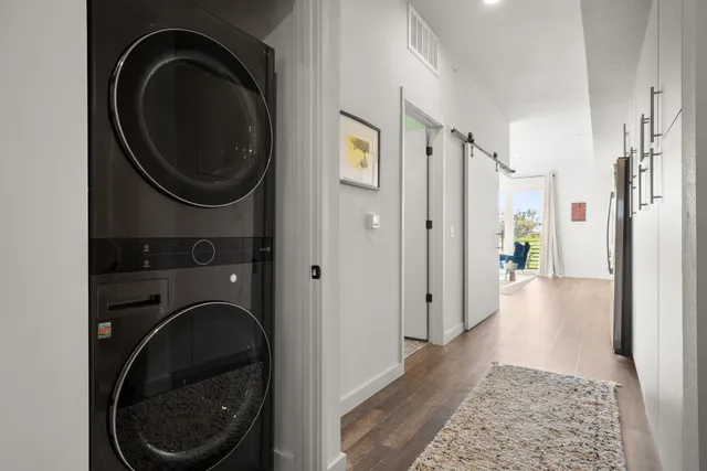 a view of a hallway with washer and dryer