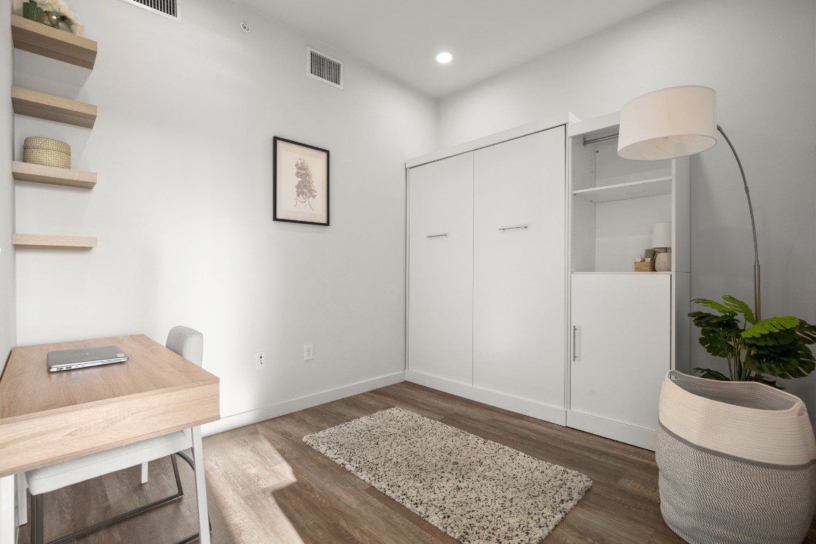 4004 Banister Lane, Unit 202 Austin, TX 78704 - Photo 7 of 23 a view of workspace with furniture and wooden floor