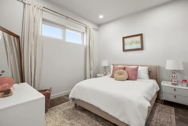 a bedroom with a bed and a table