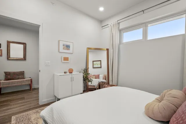 a bedroom with a bed and a couch