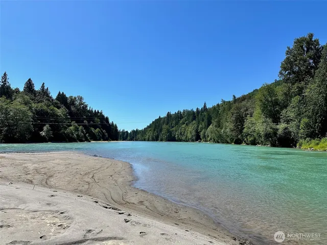 a view of a field with an trees