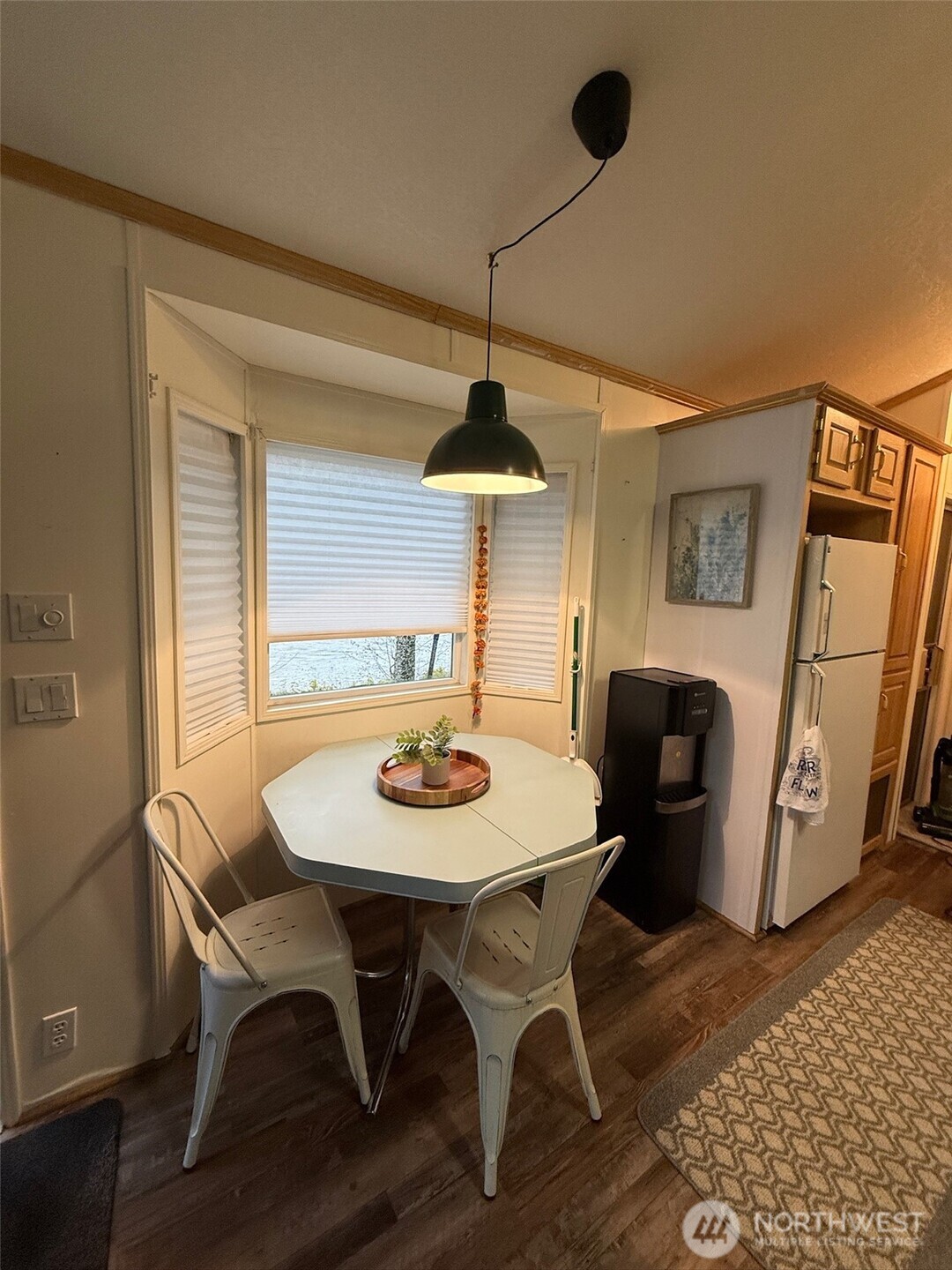 9391 Colony Lane Concrete, WA 98237 - Photo 6 of 35 a view of a dining room with furniture and a chandelier