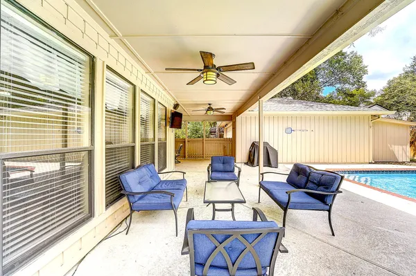 a outdoor living space with furniture and a potted plant
